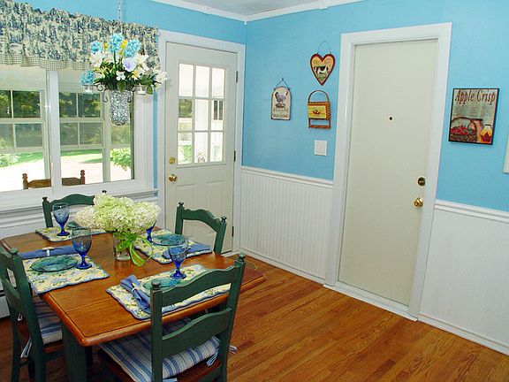 Eat-in kitchen opens to 3-season porch