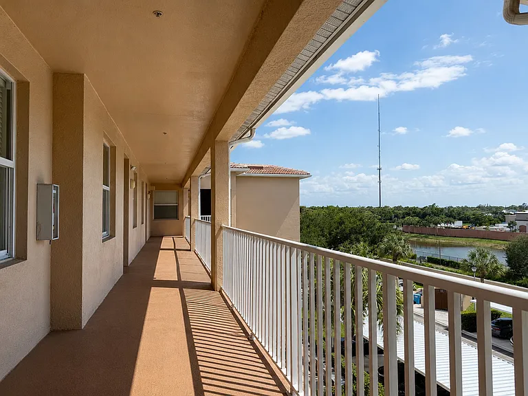 Top-floor residence with convenient elevator access and open community views