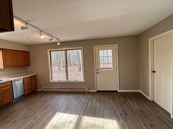 Kitchen view into back woods