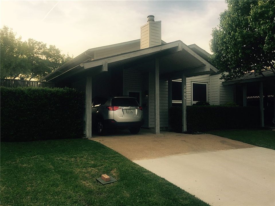 Chimney is trimmed out in Hardy Board siding. HOA maintains the vinyl siding. In front of the car is