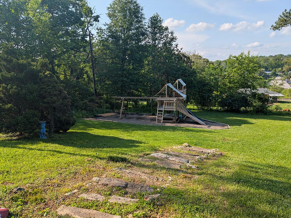 The backyard has a large swingset