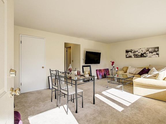 Another living room with picture window overlooking garden