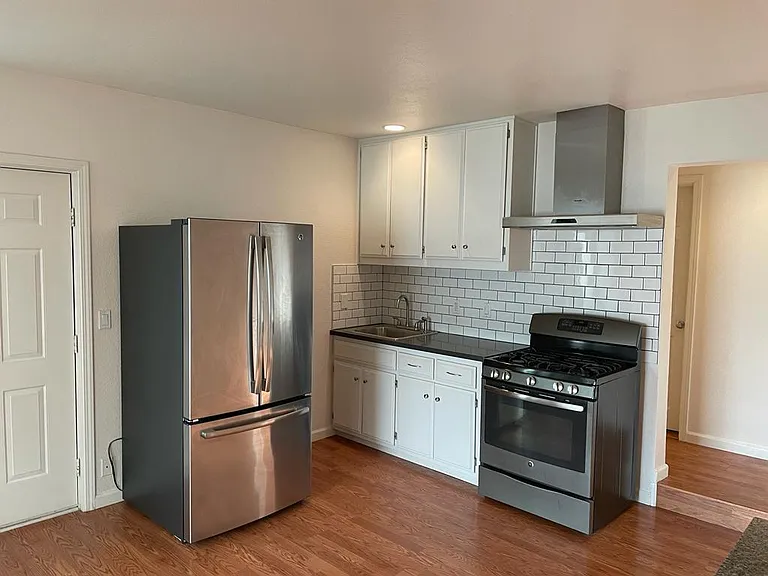 Subway tile backsplash, Quartzite countertop, Stainless Steel appliances
