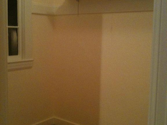 larger walk in closet off hallway