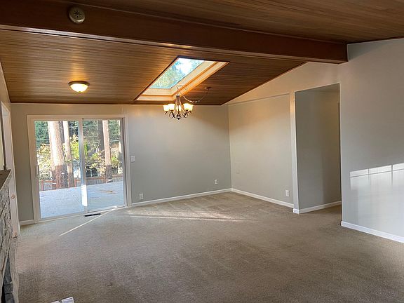 Living Room 3 - Slider off to private deck. Hallway leads to bedrooms, bath and laundry