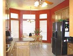 Kitchen with updated counters, under cabinet lighting, beautiful wood cabnetry