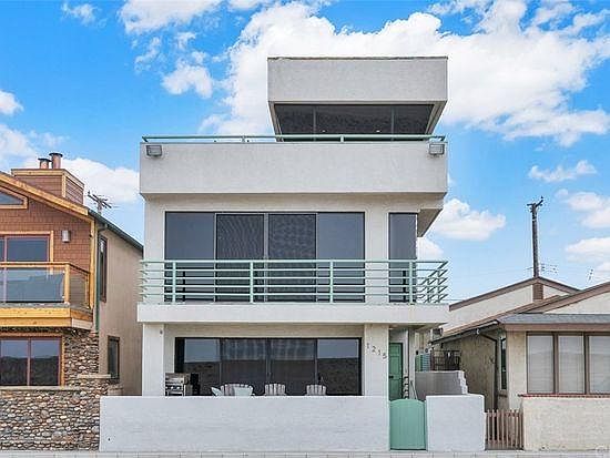 looking at the house from the sand. the lower unit is for rent.