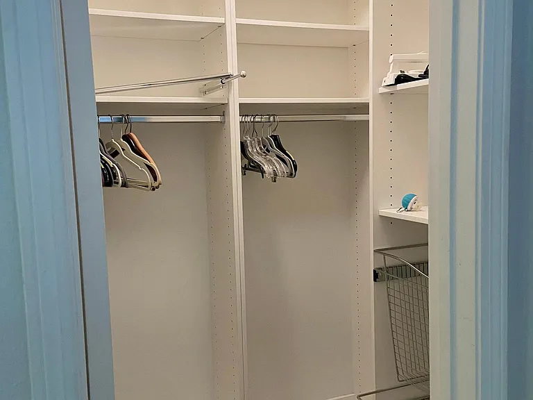 One of the three primary bedroom closets. Lots of closet space !!