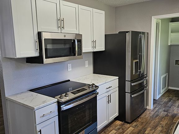 The home has gray floors throughout now. Theres a picture attached...