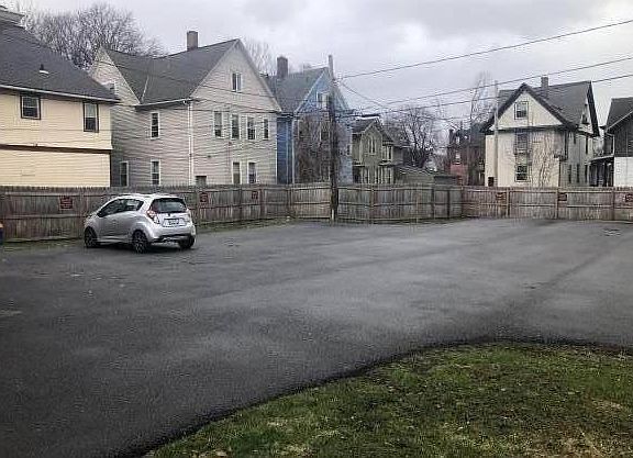 Parking lot facing backyard