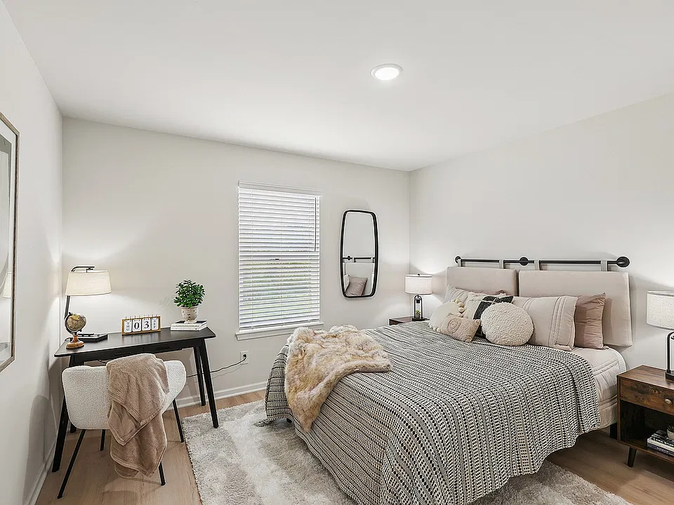 Spacious guest bedroom with room for a home office