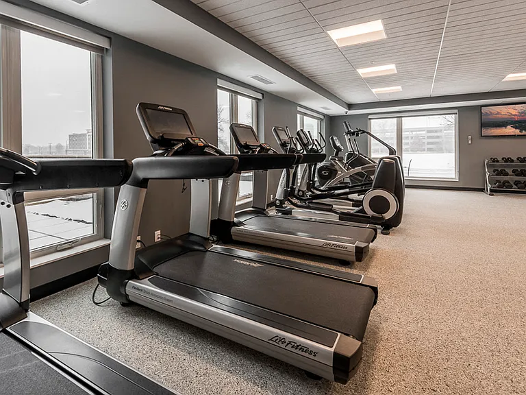 Our expansive fitness center feels like a true gym with cardio equipment, weightlifting machines and free weights.