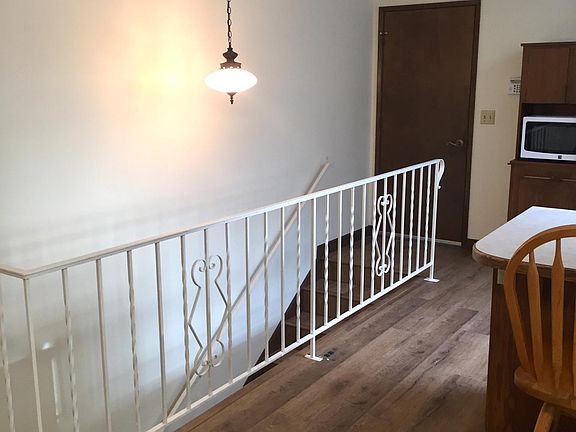 dining room, kitchen and stairs to basement