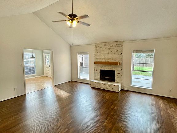 Living room with updated fireplace.