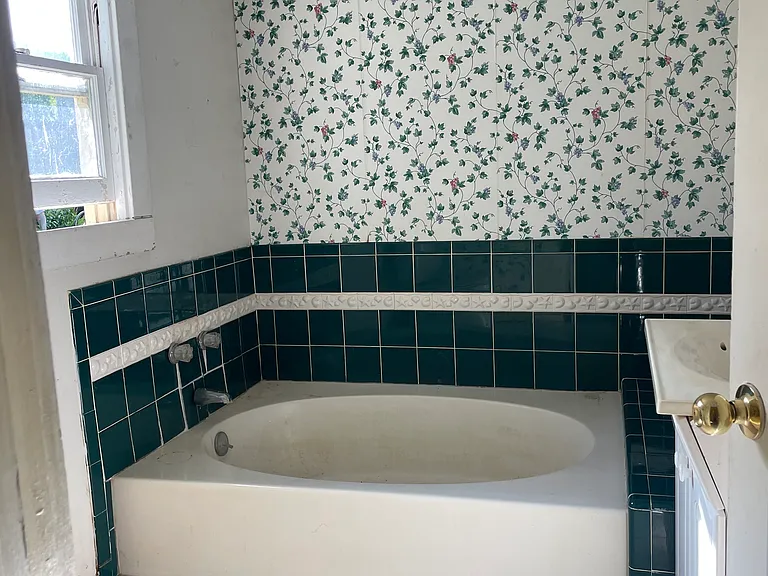 oval tub downstairs bathroom
