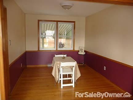 dining room
						:
						hardwood floors and chair railing
