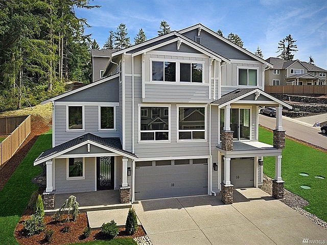 Grandview floor plan: 4 BD w/ loft, main floor Jr. Suite, sunroom w/ fireplace and deck