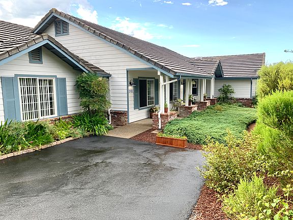 Front of the house and parking.