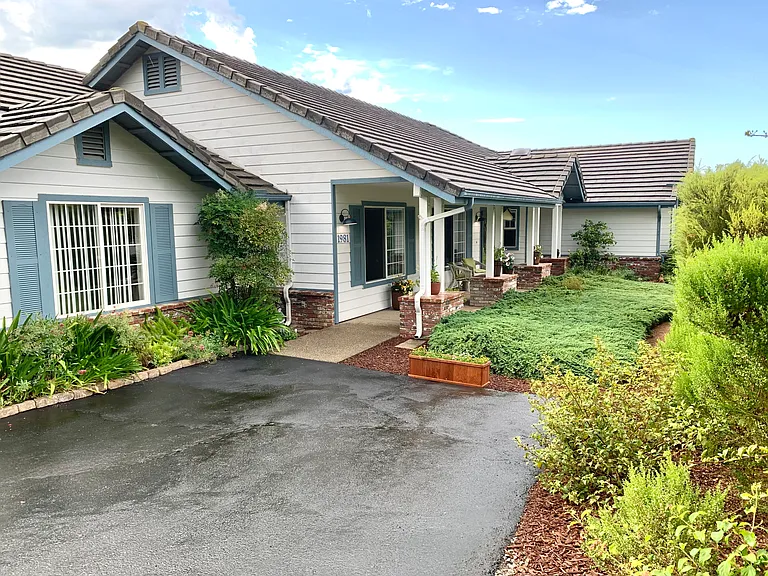 Front of the house and parking.