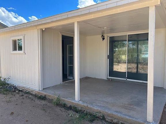 Covered Patio, Entrance to Dining Area from slider door, Entrance to Utility Room