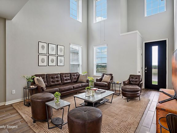 Virtually staged living room in the Medina floorplan at a Meritage Homes community.