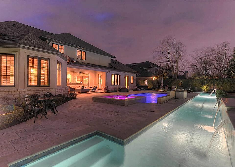 Your own private paradise! Estate-sized lot (18,900 sq.ft./HCAD), complete with large covered patio, outdoor kitchen area with built-in Jenn-Aire gas grill & vent hood, & dual pools!