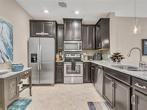 4th image of 7573 Laureate Blvd #1408