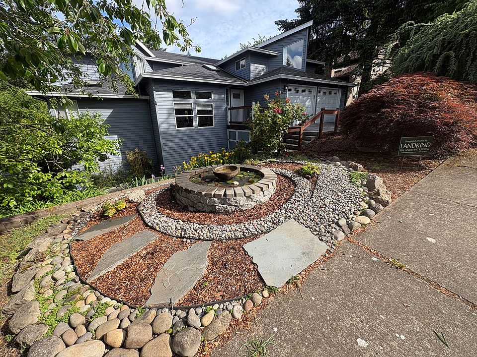 Curbside view of home with Water Lily pond. Rental unit is on bottom floor of quiet newly remodeled 3 story home.