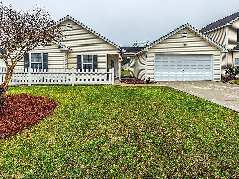 Front Entrance & Covered Walkway to Garage