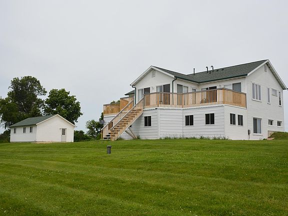 3 south facing decks and enclosed beneath, 3 season porch. 3 car detached garage. (1 stall reserved for landlord supplies).