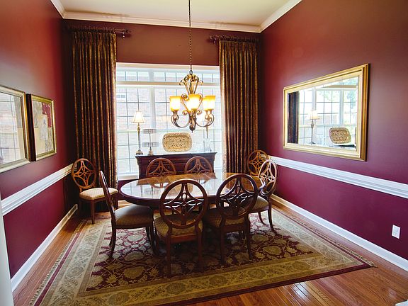 Formal Dining room. All window treatments/curtains remain with house!