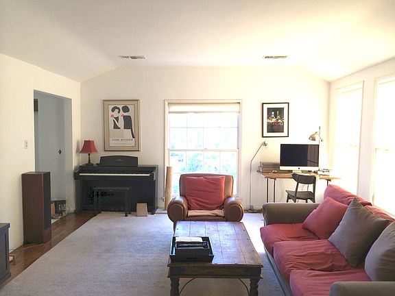 Living room - doorway to left leads to stairs to front door.