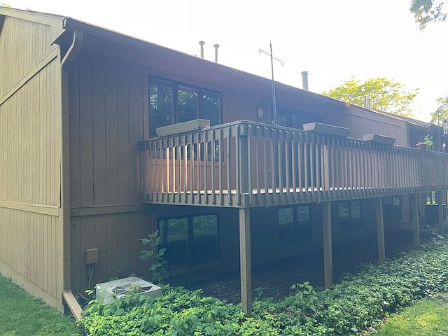 Rear deck, looks out on wooded area.