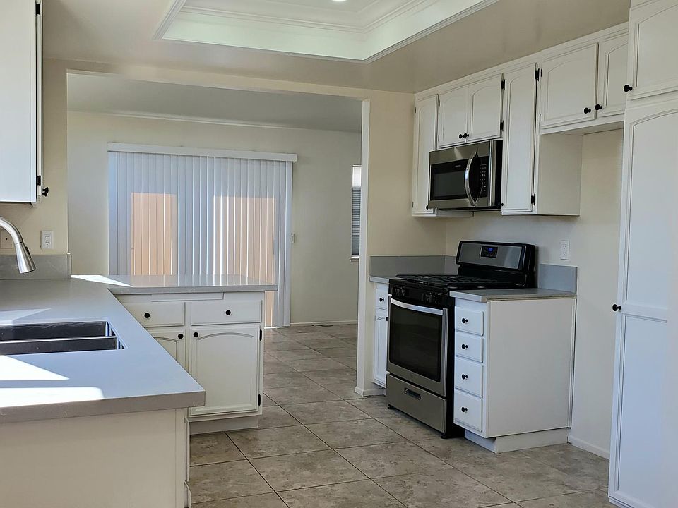 Open Kitchen with lots of cabinets and pantry, includes a brand new stainless steel LG refrigerator.
