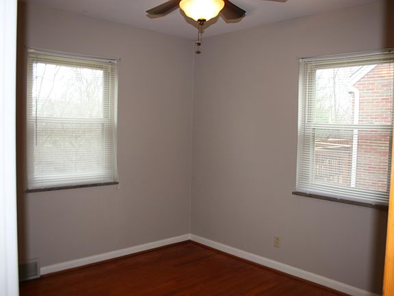 Bedroom 2 on the first floor has hardwood floors 