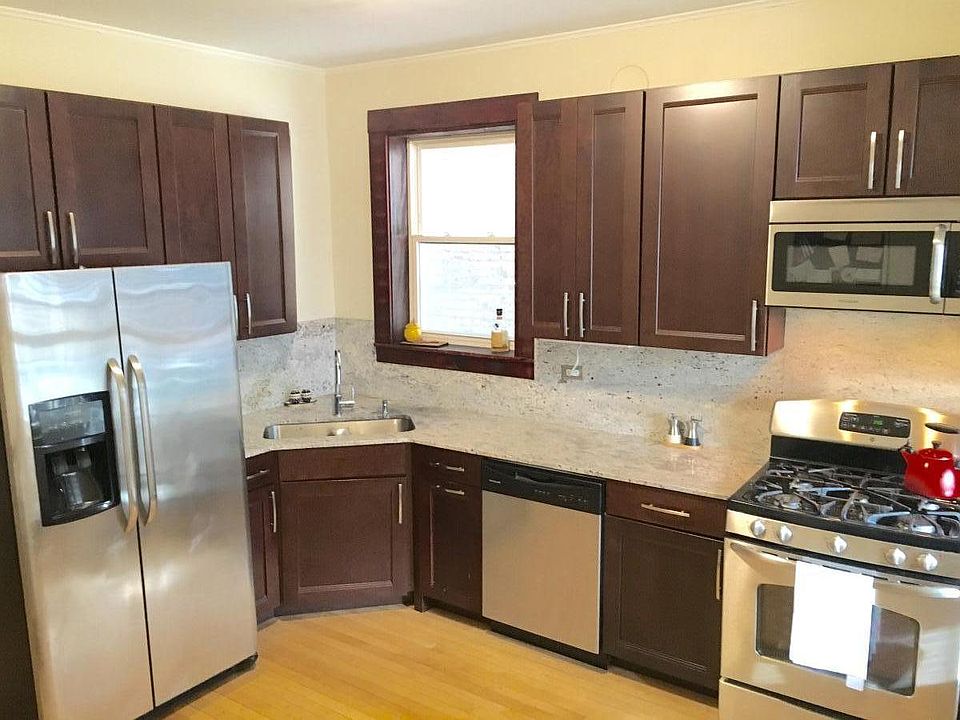 Stainless steel kitchen with granite counter tops and walk-in pantry with lots of storage