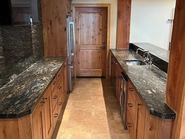 Bar with full size refrigerator, dishwasher, wine refrigerator, locking cabinets, reverse osmosis drinking water and instant hot water dispenser