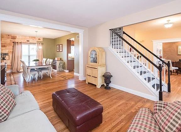 Open Floor plan with a lot of space for everyone.  Formal Living room leads to Dining room with custom wall made of wood wine boxes and inlay wood floor.  Beautiful main floor office with built ins.