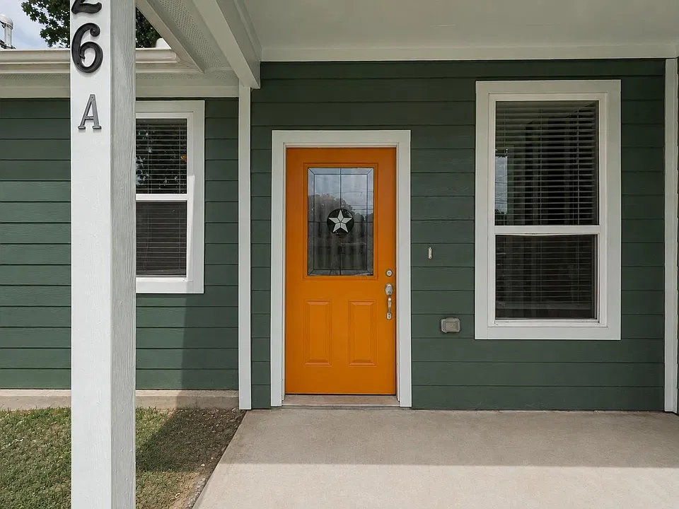 Covered front porch with a private entrance.