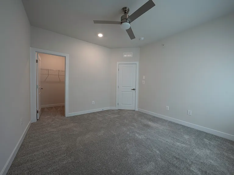 Bedroom 3 features a walk-in closet