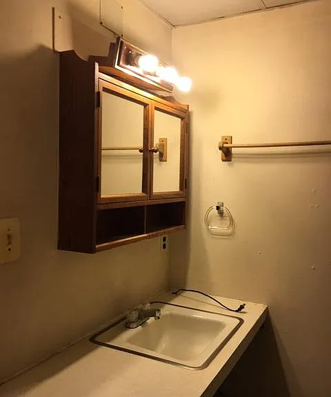 MEDICINE CABINET HAS ADEQUATE LIGHTS FOR SHAVING AND/OR MAKEUP . CORD IS FOR AN ELECTRIC HEATER IN THE BATHROOM.