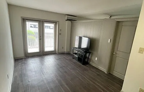 Open living room space with private patio doors