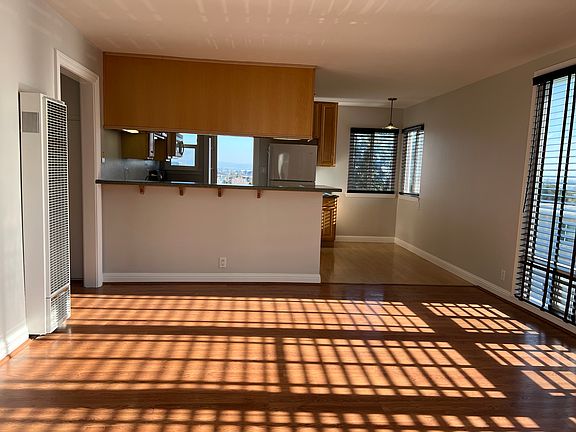 Open kitchen/living room with eat-in counter top.