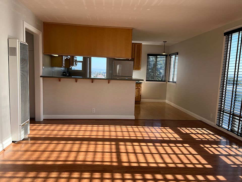 Open kitchen/living room with eat-in counter top.