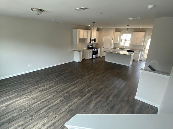 Living room, dining room, and kitchen on an open-concept