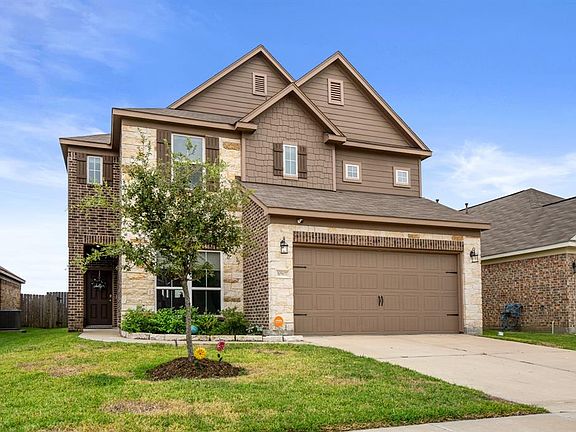 Great curb appeal, as you approach this delightful 2 story home in Ashford Grove.