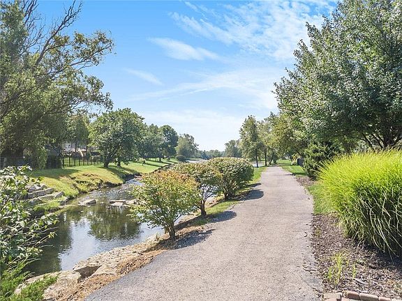 Enjoy exercising on the path beside the neighborhood lake.