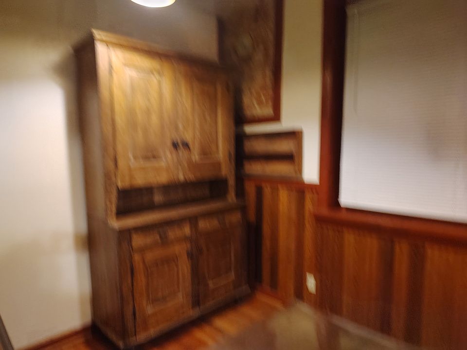 This is the other side of the kitchen featuring a large cabinet for storage.