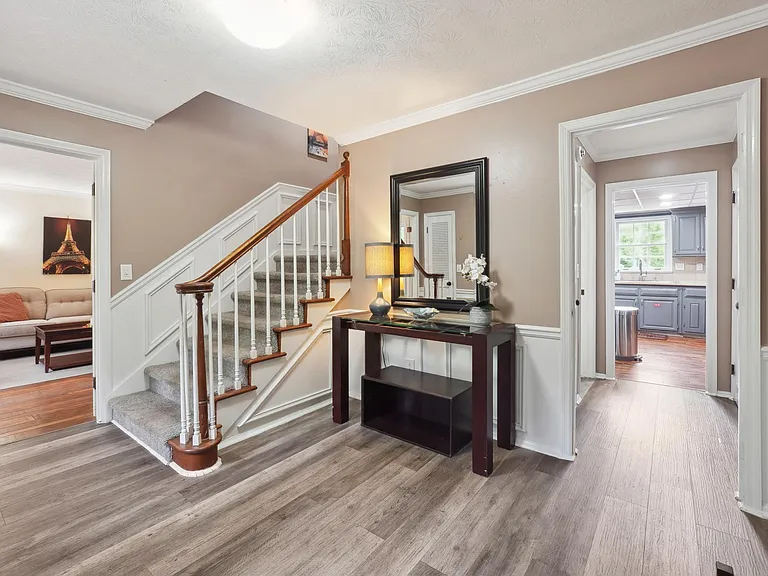 Main Entrance Foyer with staircase to Upstairs & door to Basement -Main Level