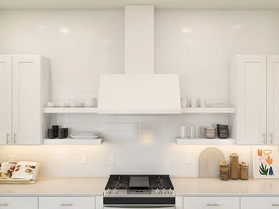 Kitchen with floating shelves and subway tile backsplash